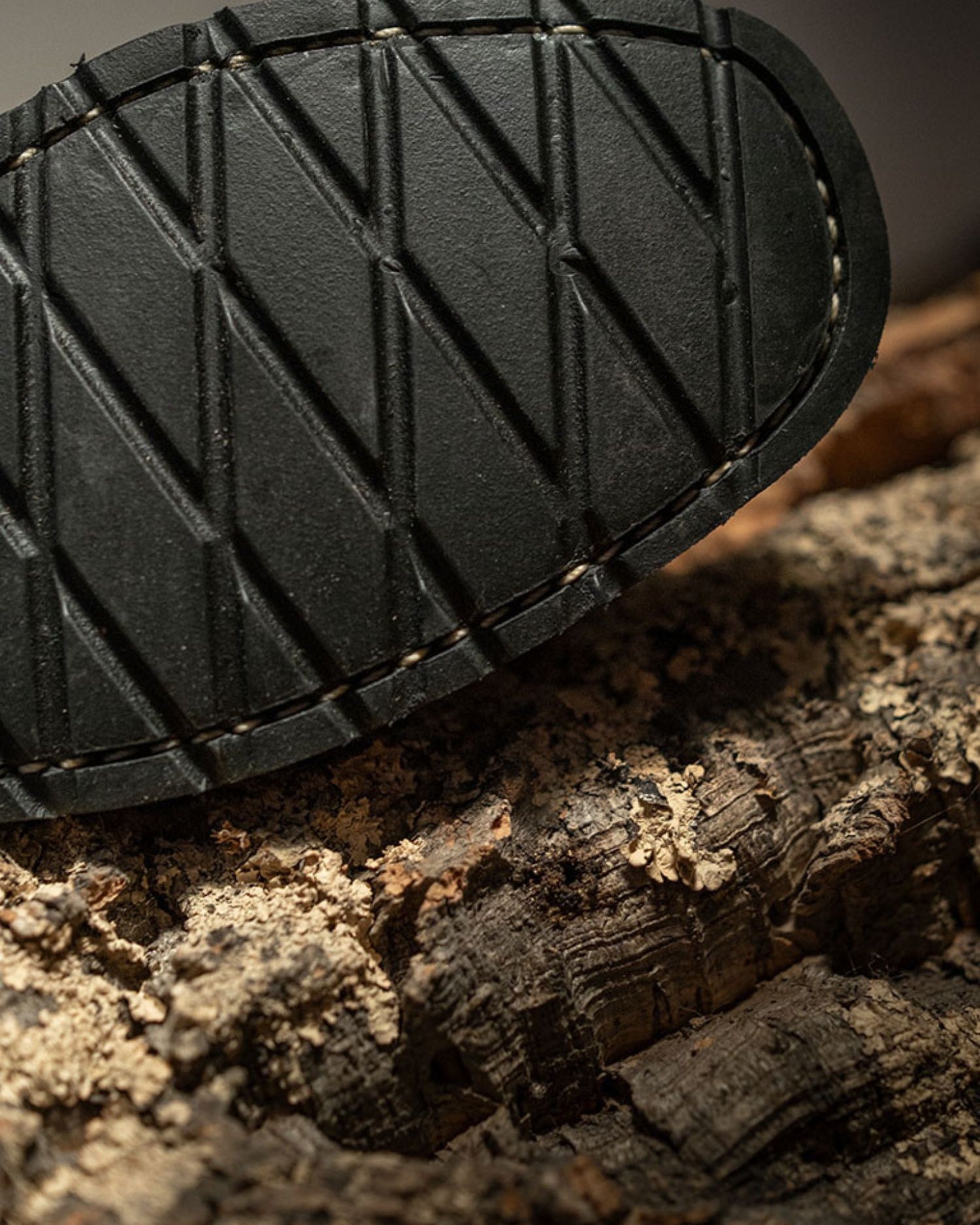 Close-up of Lobo Boots durable black rubber outsole with anti-slip pattern for superior grip.