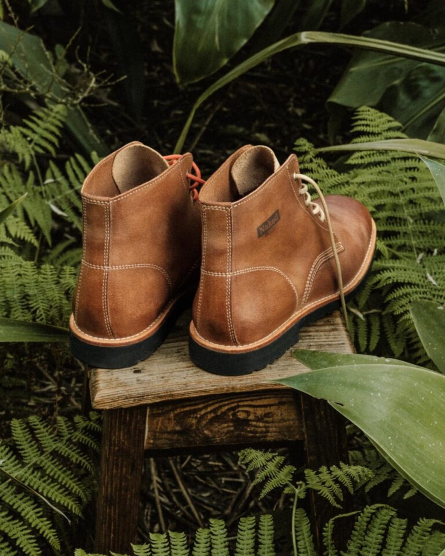 Rear view of Lobo Apparel Raw Boots highlighting the premium leather construction and handcrafted finish.