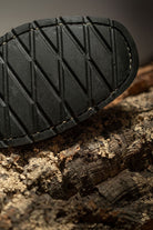 Close-up of Lobo Boots durable black rubber outsole with anti-slip pattern for superior grip.