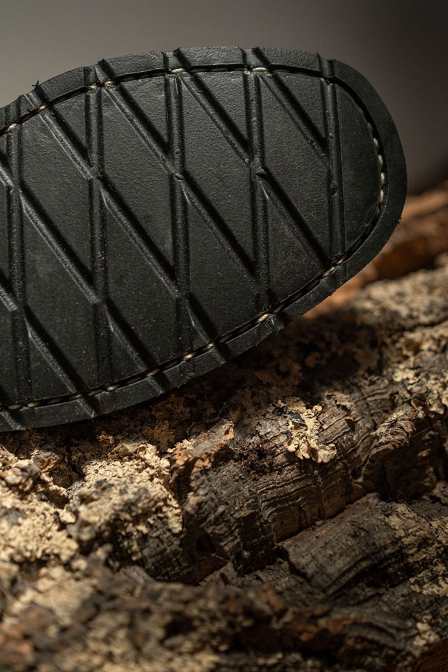Close-up of Lobo Boots durable black rubber outsole with anti-slip pattern for superior grip.