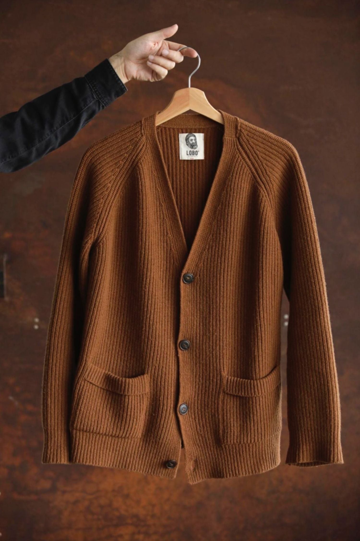Lobo Apparel unisex brown wool cardigan, ribbed knit with front buttons and side pockets.