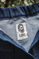 Close-up of the Lobo Apparel woven label on a handmade denim skirt made from leftover fabric.