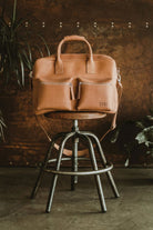 Handcrafted Lobo premium brown leather suitcase with front pockets, a timeless design piece handmade to order.