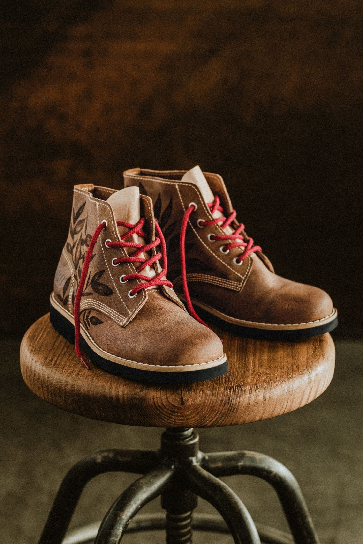Pair of exclusive Lobo Raw Boots by Cláudia Salgueiro featuring handcrafted nature drawings on leather. Limited edition Portuguese artisanal footwear.