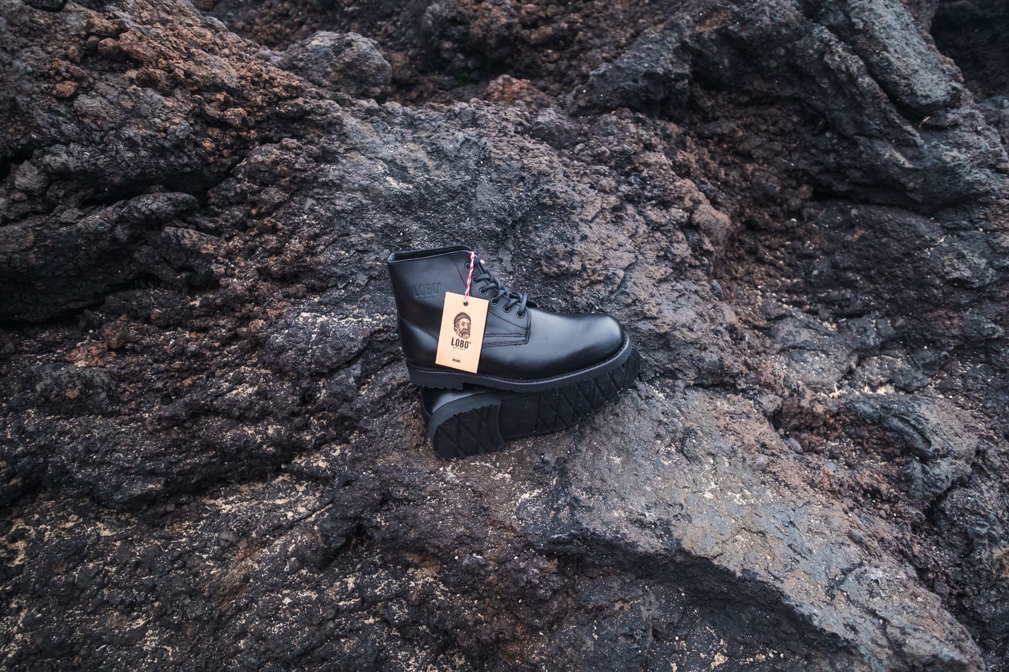 Lobo All Black Boots handmade leather boots shot by Paulo Jorge on the volcanic stone of the Azores.