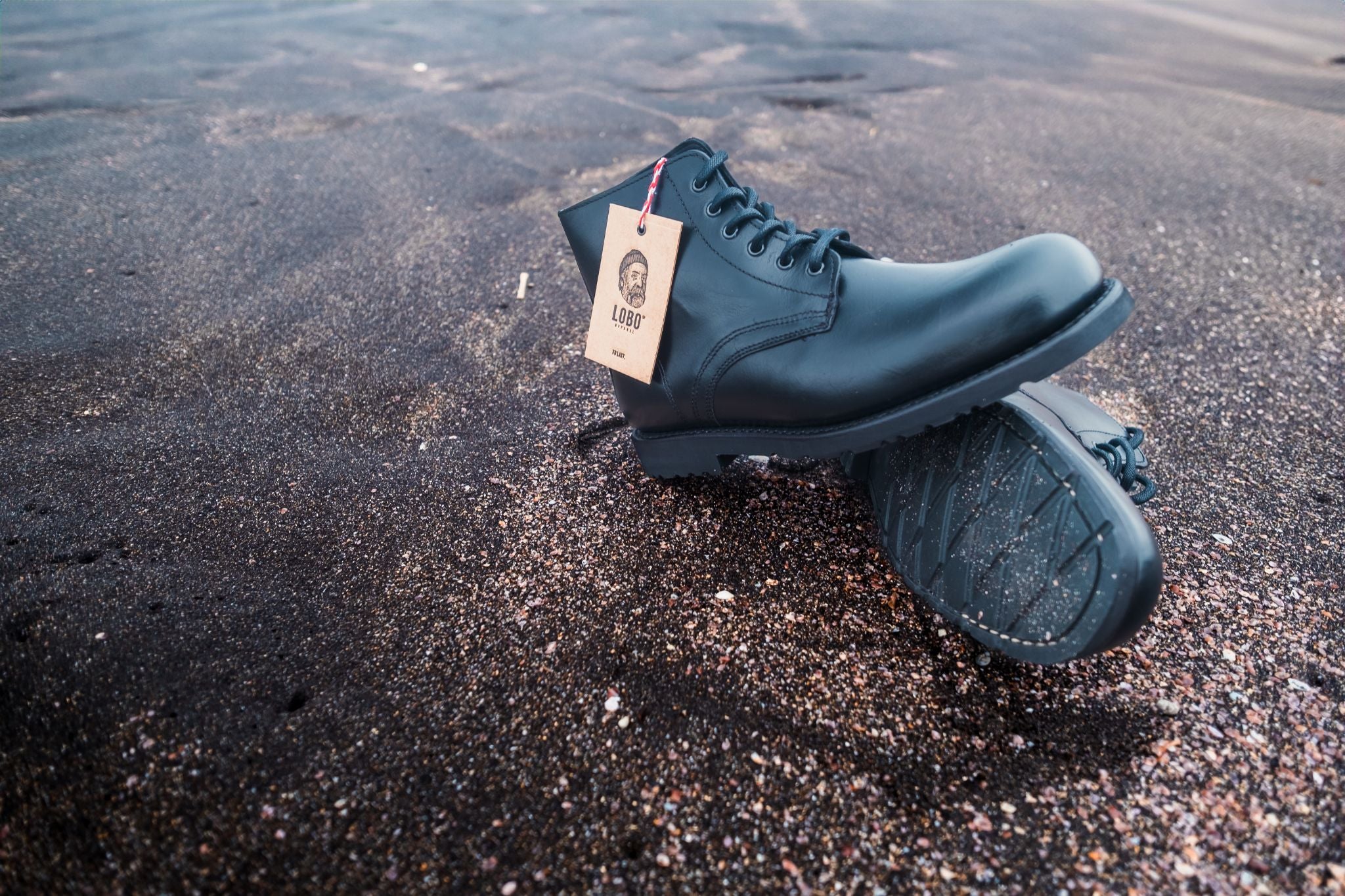 Lobo Apparel All Black Boots handmade leather boots shot by Paulo Jorge on the volcanic stone of the Azores.