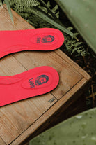 Detail of the red Lobo Insoles leather insole with a perforated support and breathability area.